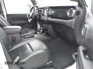 2023 Jeep Wrangler Sahara with VIN 1C4HJXEG5PW581632, listed as a IAAI auction lot 42462622 with 24,550 mi miles and . Bid and sale history available at DreamBid. Image 5.