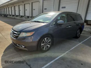 2015 Honda Odyssey Touring Elite with VIN 5FNRL5H9XFB001410, listed as a Copart auction lot 62214435 with 166,828 mi miles and Salvage title. Bid and sale history available at DreamBid. Image 1.