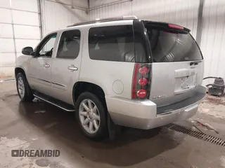 2014 GMC Yukon Denali with VIN 1GKS2EEF0ER134804, listed as a IAAI auction lot 41582709 with 142,192 mi miles. Bid and sale history available at carsss.com. Image 3.