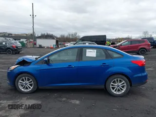 2018 Ford Focus SE z VIN 1FADP3F23JL200674, wystawiony jako IAAI lot #42009238 z przebiegiem 78 007 mil mil oraz . Historia ofert i sprzedaży dostępna na DreamBid. Obrazek 14.