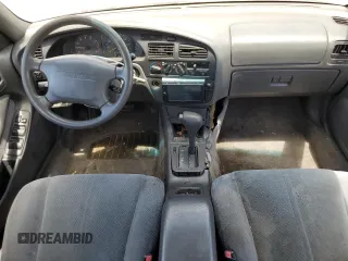 1996 Toyota Camry LE with VIN 4T1BF12K5TU861825, listed as a Copart auction lot 59803174 with 217,650 mi miles and Salvage title. Bid and sale history available at DreamBid. Image 8.