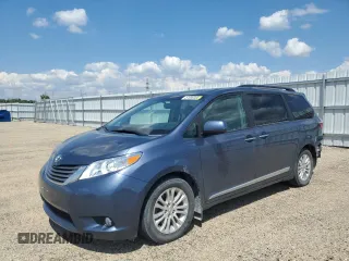 2015 Toyota Sienna XLE with VIN 5TDYK3DC4FS619385, listed as a Copart auction lot 57090385 with 112,896 mi miles and Salvage title. Bid and sale history available at DreamBid. Image 1.