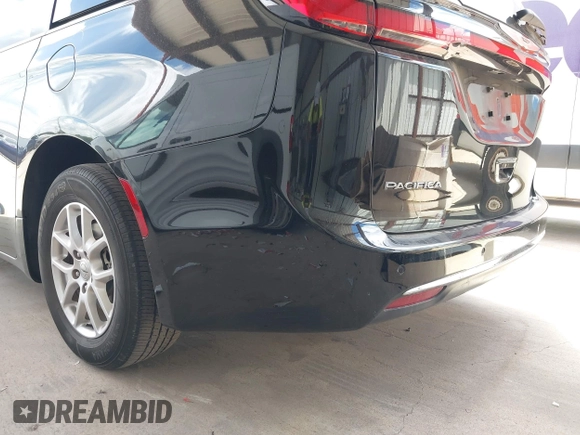 2023 Chrysler Pacifica Touring L with VIN 2C4RC1BG1PR550628, listed as a IAAI auction lot 42553430 with 61,773 mi miles and . Bid and sale history available at DreamBid. Image 22.