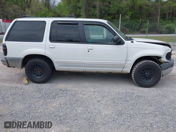 1999 Ford Explorer XLT z VIN 1FMZU34E1XZA39121, wystawiony jako IAAI lot #42107728 z przebiegiem 194 374 mil mil oraz . Historia ofert i sprzedaży dostępna na DreamBid. Obrazek 12.