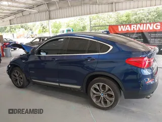 2015 BMW X4 xDrive28i with VIN 5UXXW3C51F0M87268, listed as a IAAI auction lot 42366363 with 143,285 mi miles and . Bid and sale history available at DreamBid. Image 15.