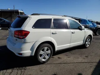 2012 Dodge Journey SXT z VIN 3C4PDCBG0CT364005, wystawiony jako Copart lot #55636265 z przebiegiem 150 048 mil mil oraz Szkoda całkowita • Salvage title. Historia ofert i sprzedaży dostępna na DreamBid. Obrazek 3.