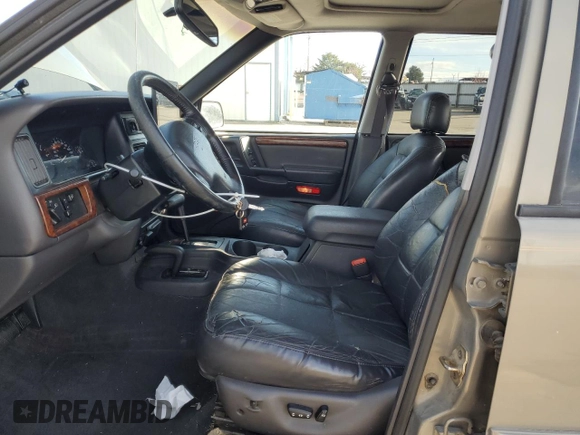 1997 Jeep Grand Cherokee Limited with VIN 1J4GZ78Y4VC754624, listed as a Copart auction lot 49884435 with 144,682 mi miles and Salvage Title. Bid and sale history available at carsss.com. Image 7.