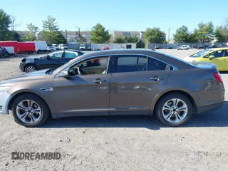 2015 Ford Taurus SEL with VIN 1FAHP2E83FG206055, listed as a IAAI auction lot 41943670 with 90,808 mi miles and . Bid and sale history available at carsss.com. Image 14.