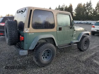 2000 Jeep Wrangler Sport with VIN 1J4FA49S1YP748529, listed as a Copart auction lot 77041924 with 154,949 mi miles and Salvage Title. Bid and sale history available at carsss.com. Image 3.