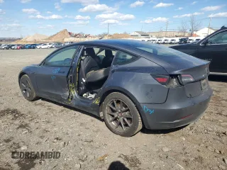 2022 Tesla Model 3 Long Range with VIN 5YJ3E1EB7NF257549, listed as a Copart auction lot 46980555 with 68,955 mi miles and Salvage Title. Bid and sale history available at DreamBid. Image 2.
