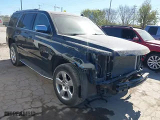 2015 Chevrolet Tahoe LTZ with VIN 1GNSCCKCXFR117525, listed as a IAAI auction lot 41839259 with 143,413 mi miles. Bid and sale history available at carsss.com. Image 1.