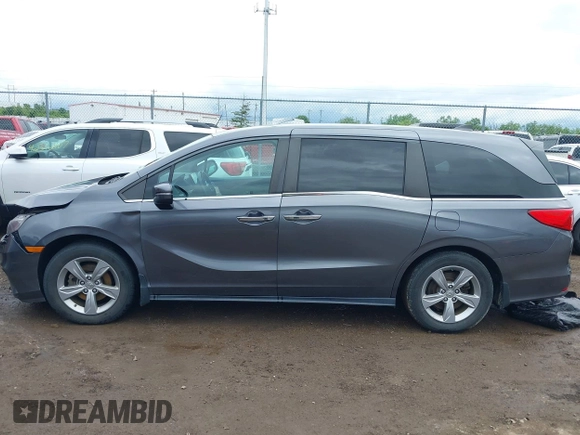 2018 Honda Odyssey EX-L z VIN 5FNRL6H74JB043276, wystawiony jako IAAI lot #42326742 z przebiegiem 126 025 mil mil oraz . Historia ofert i sprzedaży dostępna na DreamBid. Obrazek 14.