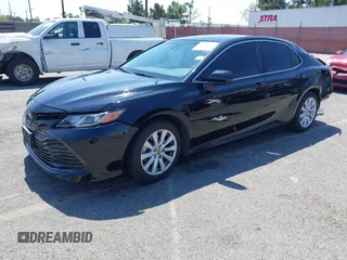 2020 Toyota Camry LE with VIN 4T1C11AKXLU955851, listed as a IAAI auction lot 41996827 with 59,008 mi miles and . Bid and sale history available at carsss.com. Image 2.