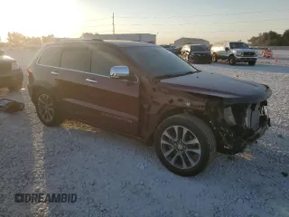 2018 Jeep Grand Cherokee Overland with VIN 1C4RJFCT3JC453784, listed as a Copart auction lot 71921944 with 56,097 mi miles and Salvage title. Bid and sale history available at DreamBid. Image 4.