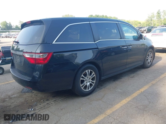 2012 Honda Odyssey EX-L with VIN 5FNRL5H60CB075811, listed as a IAAI auction lot 42518159 with 243,186 mi miles and . Bid and sale history available at DreamBid. Image 4.