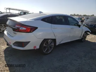 2018 Honda Clarity Touring z VIN JHMZC5F33JC002904, wystawiony jako Copart lot #55535325 z przebiegiem Nie podano mil oraz Szkoda całkowita • Salvage title. Historia ofert i sprzedaży dostępna na DreamBid. Obrazek 3.