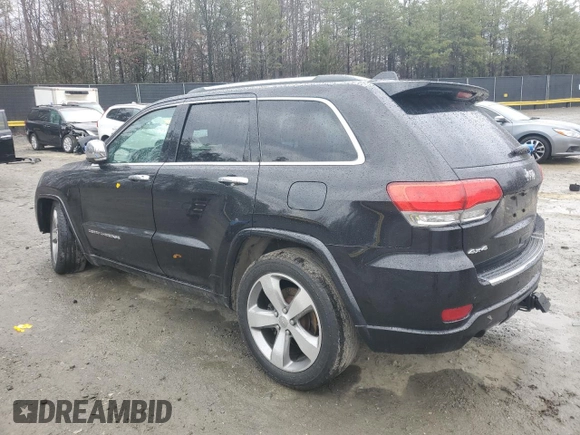 2014 Jeep Grand Cherokee Overland with VIN 1C4RJFCG1EC587458, listed as a Copart auction lot 50213015 with 124,266 mi miles and Salvage Title. Bid and sale history available at carsss.com. Image 2.