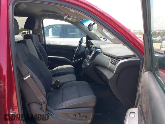 2015 Chevrolet Tahoe LS with VIN 1GNSCAEC4FR121571, listed as a IAAI auction lot 42499156 with 131,284 mi miles and . Bid and sale history available at DreamBid. Image 5.