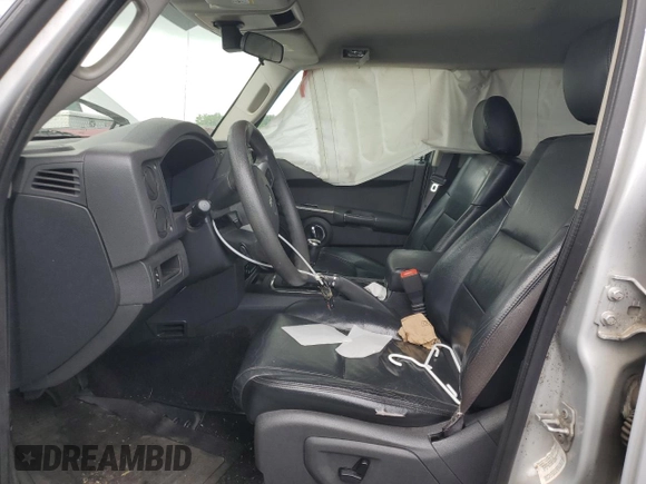 2009 Jeep Commander Sport z VIN 1J8HG48K29C531877, wystawiony jako Copart lot #58708825 z przebiegiem 198 585 mil mil oraz Szkoda całkowita • Salvage title. Historia ofert i sprzedaży dostępna na DreamBid. Obrazek 7.