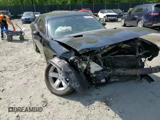 2012 Dodge Challenger SXT Plus z VIN 2C3CDYAGXCH127824, wystawiony jako Copart lot #55026435 z przebiegiem Nie podano mil oraz Szkoda całkowita • Salvage title. Historia ofert i sprzedaży dostępna na DreamBid. Obrazek 14.
