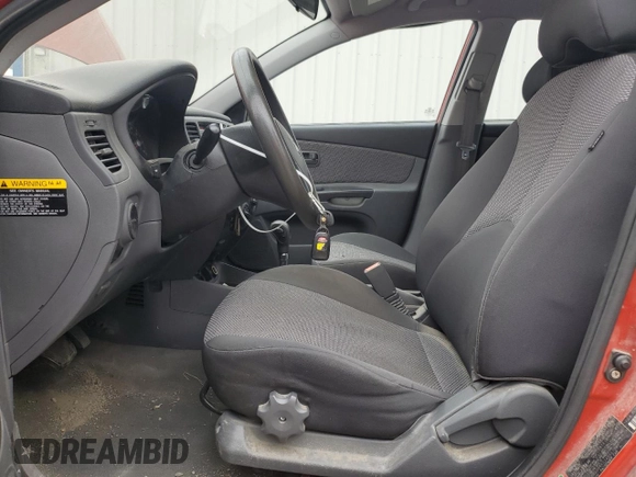 2010 Kia Rio LX with VIN KNADH4A37A6665399, listed as a Copart auction lot 72571284 with 132,610 mi miles and Salvage Title. Bid and sale history available at DreamBid. Image 7.