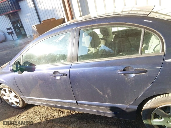 2009 Honda Civic Sdn LX with VIN 2HGFA16559H544472, listed as a IAAI auction lot 41695513 with 124,845 mi miles. Bid and sale history available at carsss.com. Image 14.