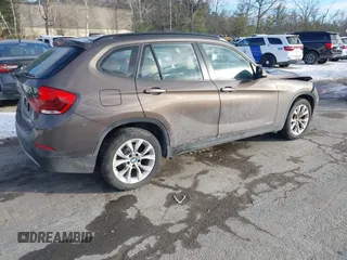 2014 BMW X1 xDrive28i with VIN WBAVL1C56EVY19340, listed as a IAAI auction lot 41340436 with 85,867 mi miles. Bid and sale history available at carsss.com. Image 4.