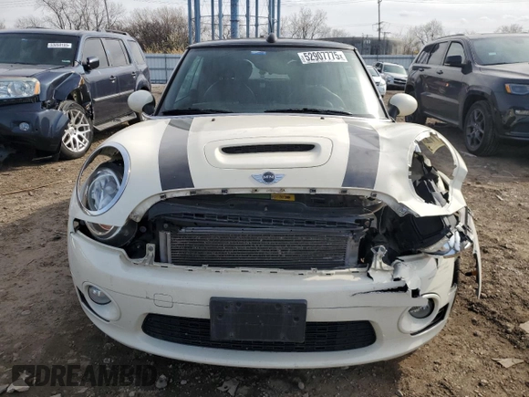2010 MINI Convertible S with VIN WMWMS3C51ATZ85166, listed as a Copart auction lot 52907775 with 90,090 mi miles and Salvage title. Bid and sale history available at DreamBid. Image 5.