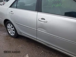 2002 Toyota Camry XLE z VIN JTDBF30K420083381, wystawiony jako IAAI lot #42368073 z przebiegiem 148 746 mil mil oraz . Historia ofert i sprzedaży dostępna na DreamBid. Obrazek 13.