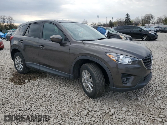 2016 Mazda CX-5 Touring with VIN JM3KE2CY8G0902131, listed as a Copart auction lot 53354745 with 123,474 mi miles and Salvage Title. Bid and sale history available at carsss.com. Image 4.