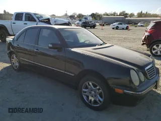 2001 Mercedes-Benz E-Class AWD with VIN WDBJF82JX1X044733, listed as a Copart auction lot 74825034 with 153,046 mi miles and Salvage Title. Bid and sale history available at carsss.com. Image 4.