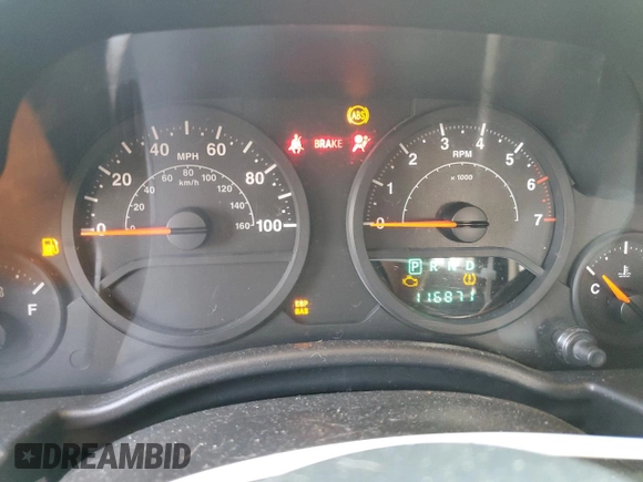 2009 Jeep Wrangler X z VIN 1J4FA24179L716499, wystawiony jako Copart lot #58342675 z przebiegiem 116 871 mil mil oraz Szkoda całkowita • Salvage title. Historia ofert i sprzedaży dostępna na DreamBid. Obrazek 9.