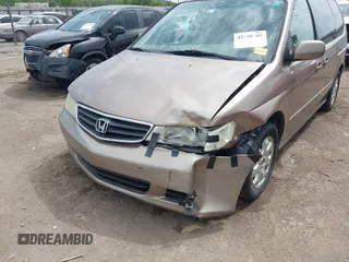 2003 Honda Odyssey EX-L z VIN 5FNRL18063B135949, wystawiony jako IAAI lot #42248105 z przebiegiem 210 567 mil mil oraz . Historia ofert i sprzedaży dostępna na DreamBid. Obrazek 6.