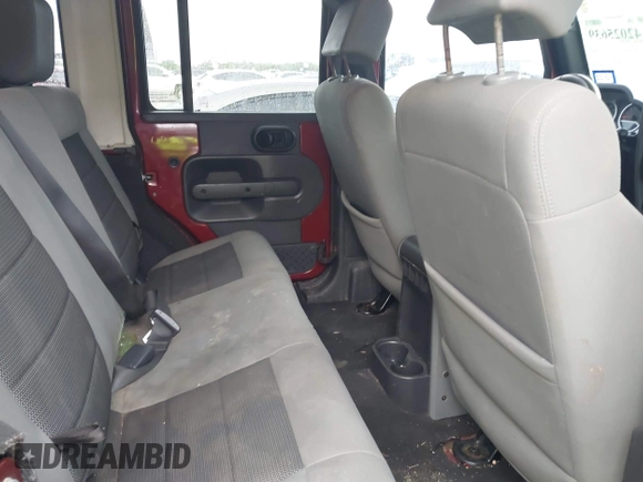 2007 Jeep Wrangler Unlimited Sahara with VIN 1J4GB59197L142223, listed as a IAAI auction lot 42025639 with 155,274 mi miles and . Bid and sale history available at DreamBid. Image 8.