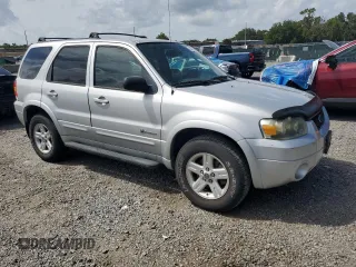 2006 Ford Escape Hybrid z VIN 1FMCU96H36KA35403, wystawiony jako Copart lot #65374705 z przebiegiem 127 689 mil mil oraz Czysty tytuł • Clean title. Historia ofert i sprzedaży dostępna na DreamBid. Obrazek 4.