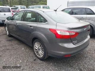 2012 Ford Focus SEL with VIN 1FAHP3H23CL348356, listed as a IAAI auction lot 42041001 with 174,510 mi miles. Bid and sale history available at carsss.com. Image 3.