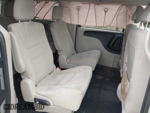 2014 Dodge Grand Caravan American Value with VIN 2C4RDGBG6ER380568, listed as a IAAI auction lot 41683180 with 303,612 mi miles and . Bid and sale history available at DreamBid. Image 8.