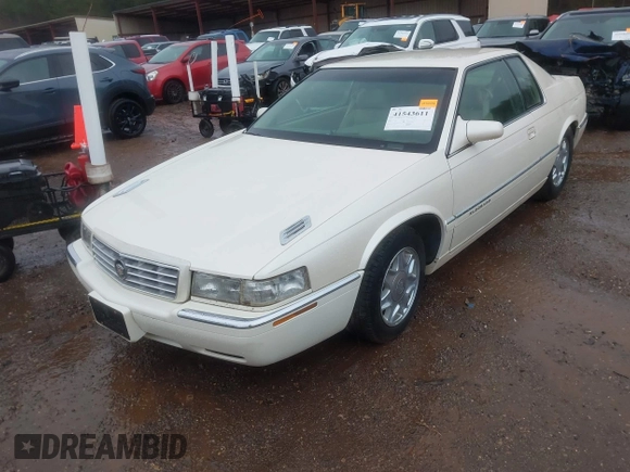 1997 Cadillac Eldorado ESC z VIN 1G6EL12Y6VU614754, wystawiony jako IAAI lot #41543611 z przebiegiem 73 273 mil mil oraz . Historia ofert i sprzedaży dostępna na DreamBid. Obrazek 2.