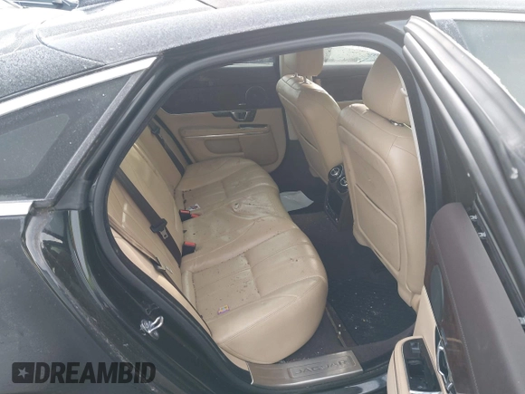 2014 Jaguar XJ with VIN SAJWA1CZXE8V74400, listed as a IAAI auction lot 38250698 with 102,205 mi miles and . Bid and sale history available at DreamBid. Image 8.