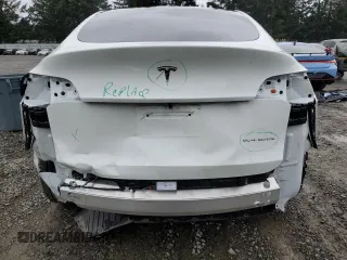 2023 Tesla Model Y Long Range z VIN 7SAYGDEE4PF836872, wystawiony jako Copart lot #45566235 z przebiegiem 7 674 mil mil oraz Szkoda całkowita • Salvage title. Historia ofert i sprzedaży dostępna na DreamBid. Obrazek 6.