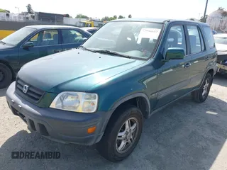 1999 Honda CR-V EX with VIN JHLRD1866XC028200, listed as a IAAI auction lot 42040657 with 207,397 mi miles. Bid and sale history available at carsss.com. Image 2.