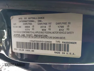 2000 Mazda 626 LX with VIN 1YVGF22CXY5123930, listed as a IAAI auction lot 40712369 with 210,234 mi miles. Bid and sale history available at carsss.com. Image 9.