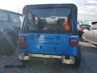 1992 Jeep Wrangler z VIN 2J4FY19P6NJ559597, wystawiony jako Copart lot #74990384 z przebiegiem 150 298 mil mil oraz Szkoda całkowita • Salvage title. Historia ofert i sprzedaży dostępna na DreamBid. Obrazek 6.