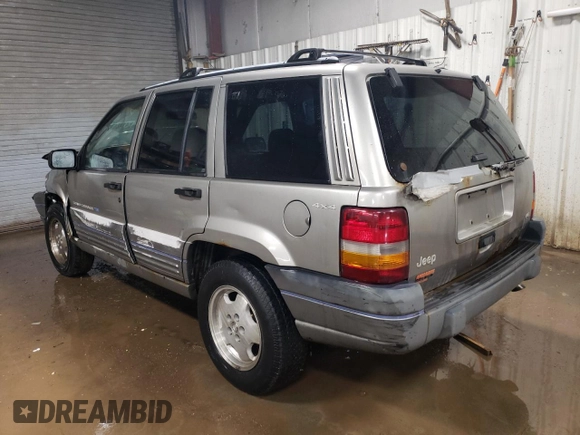 1997 Jeep Grand Cherokee Laredo with VIN 1J4GZ58Y7VC650813, listed as a Copart auction lot 41486724 with 266,004 mi miles and Salvage Title. Bid and sale history available at carsss.com. Image 2.