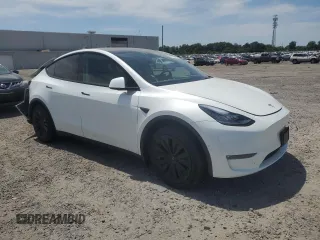 2022 Tesla Model Y Long Range z VIN 7SAYGDEE9NF455614, wystawiony jako Copart lot #57612985 z przebiegiem 22 101 mil mil oraz Szkoda całkowita • Salvage title. Historia ofert i sprzedaży dostępna na DreamBid. Obrazek 4.