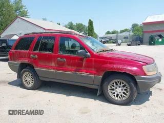 2001 Jeep Grand Cherokee Laredo z VIN 1J4GW48S11C720055, wystawiony jako IAAI lot #42453532 z przebiegiem 158 486 mil mil oraz . Historia ofert i sprzedaży dostępna na DreamBid. Obrazek 14.