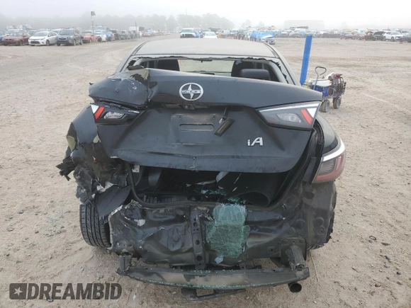 2016 Scion iA z VIN 3MYDLBZV8GY100948, wystawiony jako Copart lot #53285015 z przebiegiem 192 027 mil mil oraz Szkoda całkowita • Salvage title. Historia ofert i sprzedaży dostępna na DreamBid. Obrazek 6.