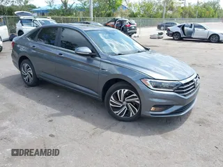 2021 Volkswagen Jetta SEL Premium z VIN 3VWG57BUXMM100583, wystawiony jako IAAI lot #42104200 z przebiegiem 32 227 mil mil oraz . Historia ofert i sprzedaży dostępna na DreamBid. Obrazek 1.