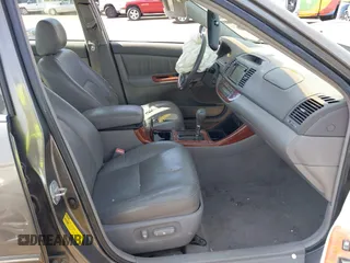 2004 Toyota Camry LE with VIN 4T1BF30K24U569209, listed as a IAAI auction lot 41988665 with 191,017 mi miles. Bid and sale history available at carsss.com. Image 5.