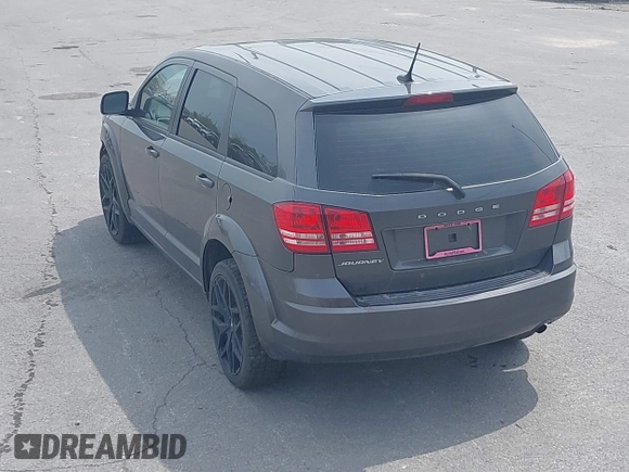 2015 Dodge Journey SE z VIN 3C4PDCAB4FT675074, wystawiony jako IAAI lot #42059878 z przebiegiem 99 947 mil mil oraz . Historia ofert i sprzedaży dostępna na DreamBid. Obrazek 13.